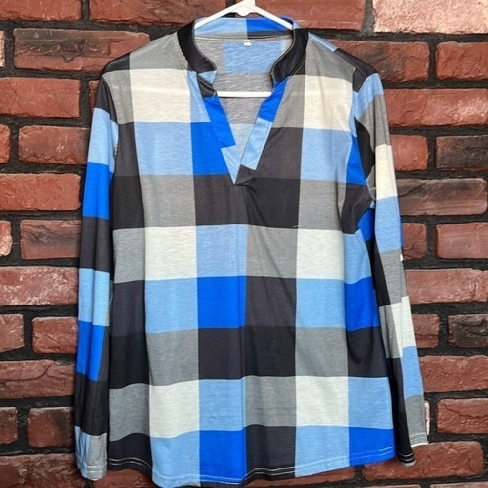 Never worn! Polyester and spandex blouse.